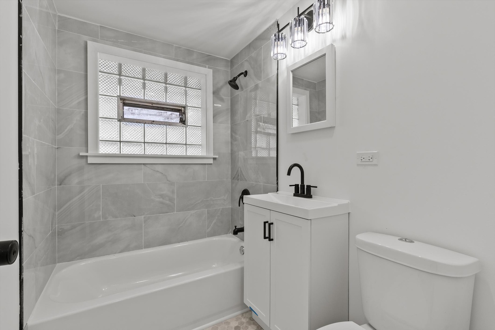 3735 169th Street Country Club Hills, IL 60478 - Photo 7 of 17 a bathroom with a sink a toilet and shower