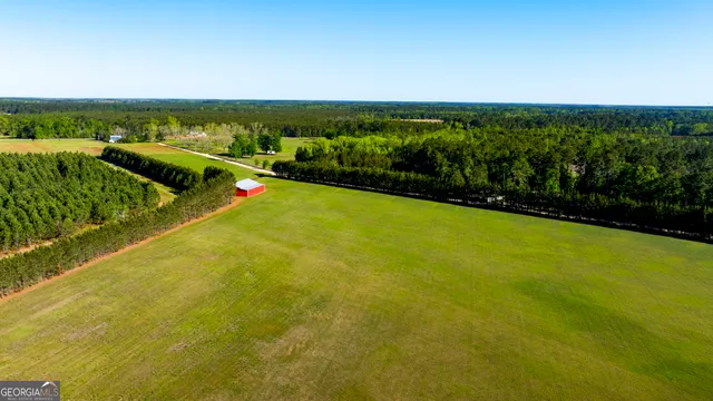 a view of yard with wooden fence