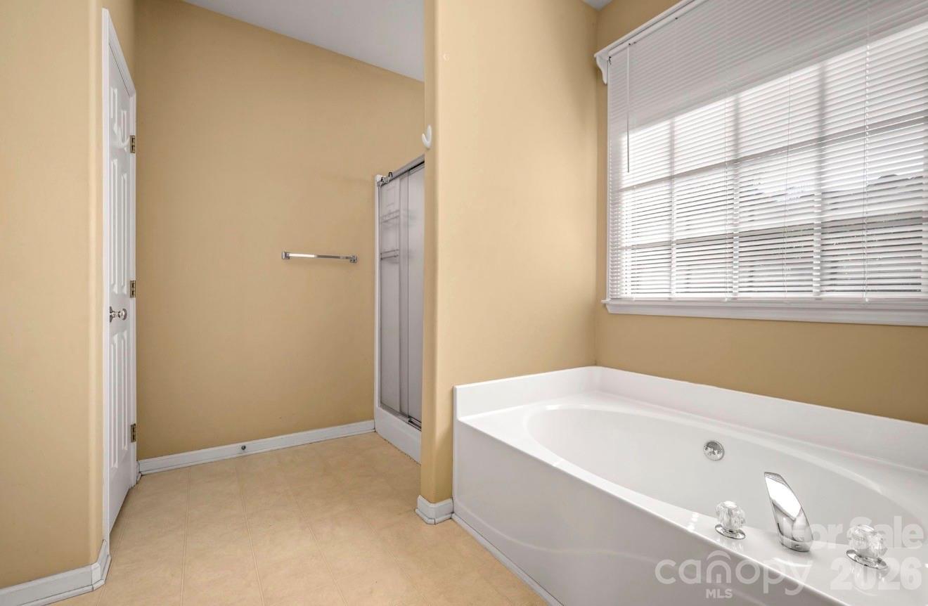 523 Shepherds Creek Circle Rutherfordton, NC 28139 - Photo 23 of 31 a bathroom with a bathtub and shower