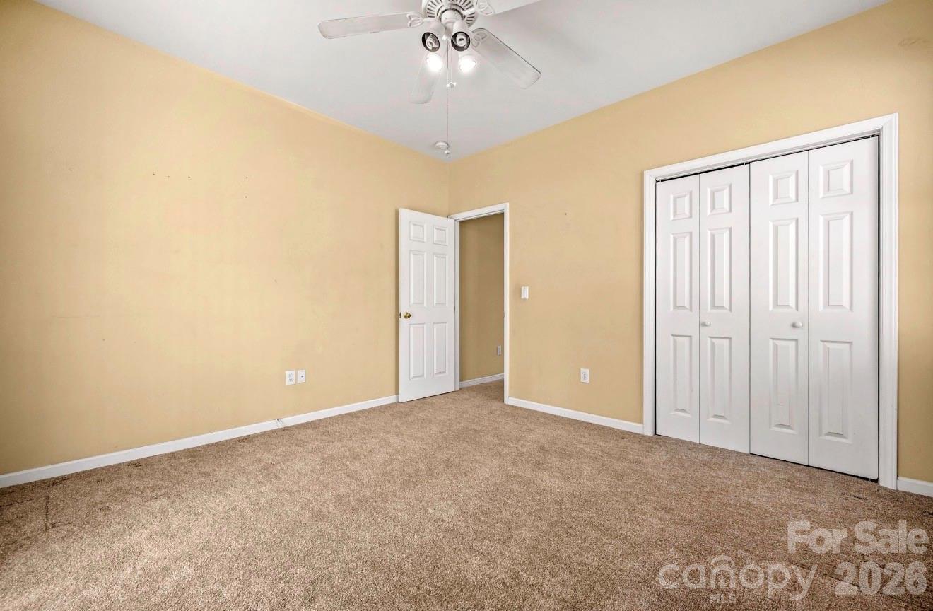 523 Shepherds Creek Circle Rutherfordton, NC 28139 - Photo 30 of 31 an empty room with a ceiling fan and a window