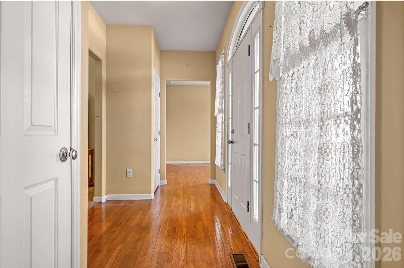 523 Shepherds Creek Circle Rutherfordton, NC 28139 - Photo 9 of 31 a view of a hallway with wooden floor and a bathroom