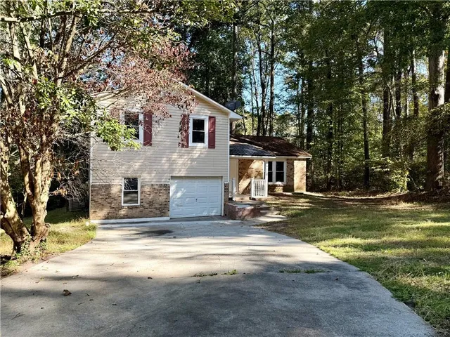 a backyard of a house with lots of green space
