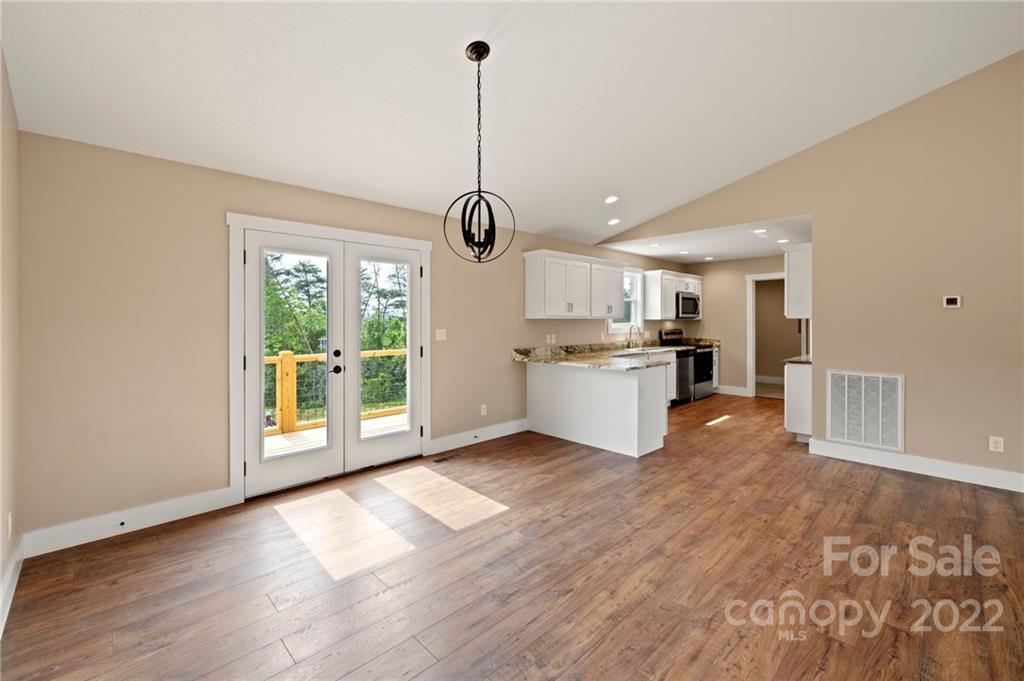 53 Sharptown Road Canton, NC 28716 - Photo 11 of 34 a view of a kitchen with wooden floor and a window