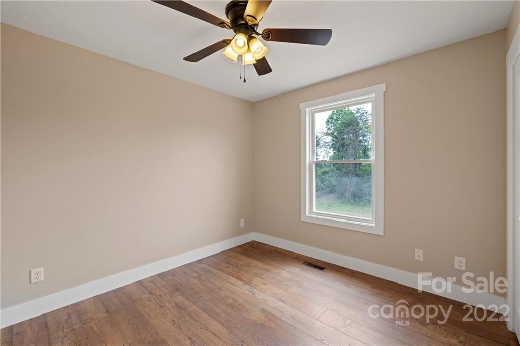 53 Sharptown Road Canton, NC 28716 - Photo 26 of 34 an empty room with windows and fan