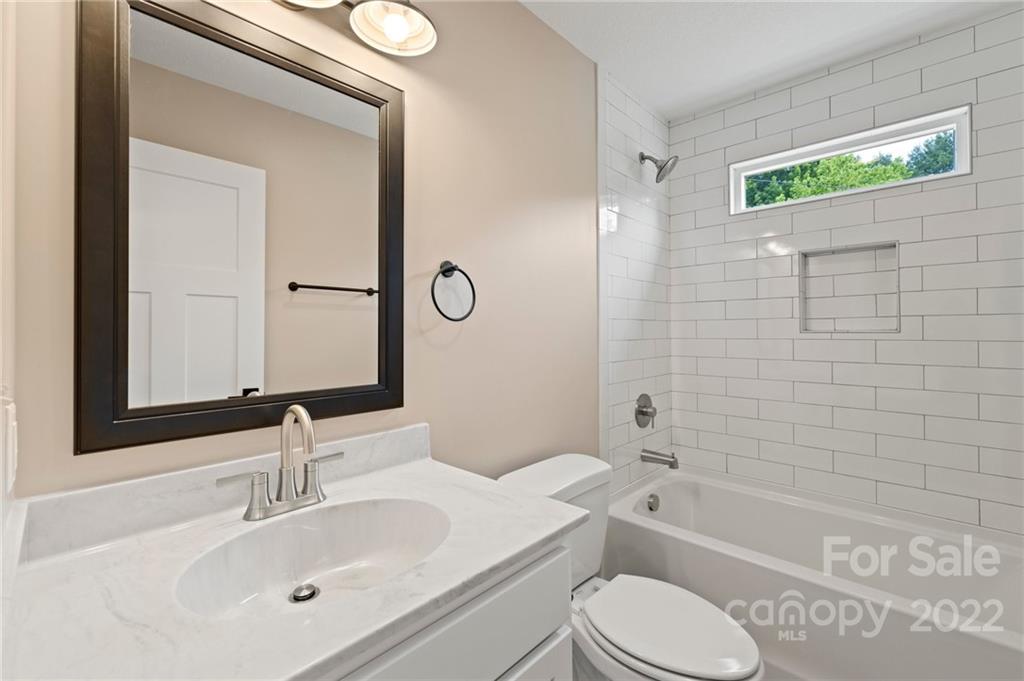 53 Sharptown Road Canton, NC 28716 - Photo 29 of 34 a bathroom with a sink toilet and shower