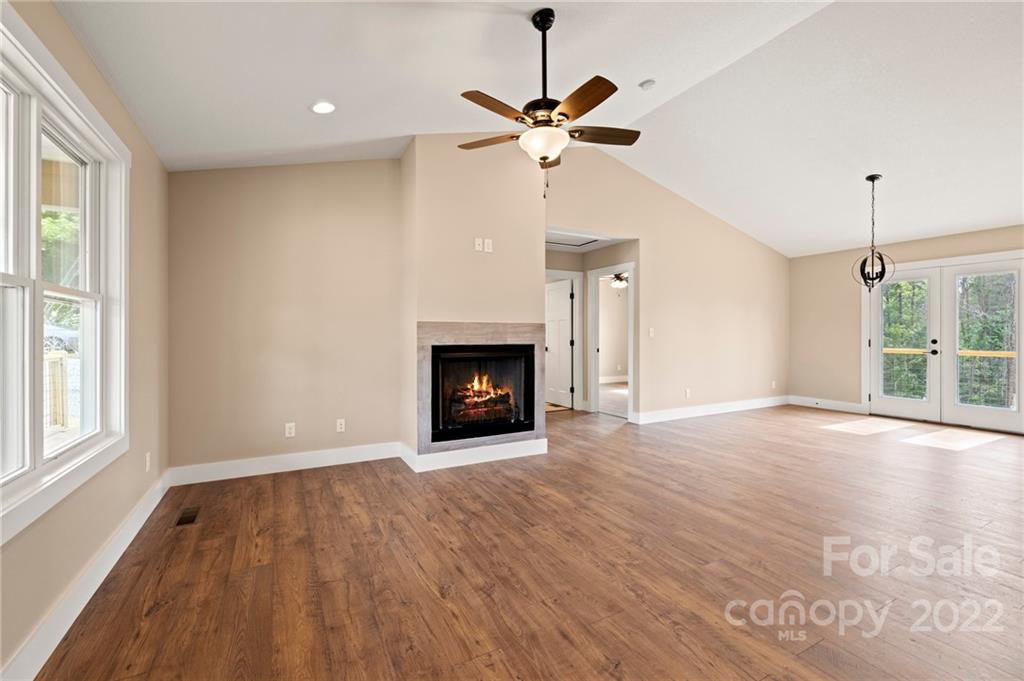 53 Sharptown Road Canton, NC 28716 - Photo 6 of 34 a view of an empty room with a window and fireplace