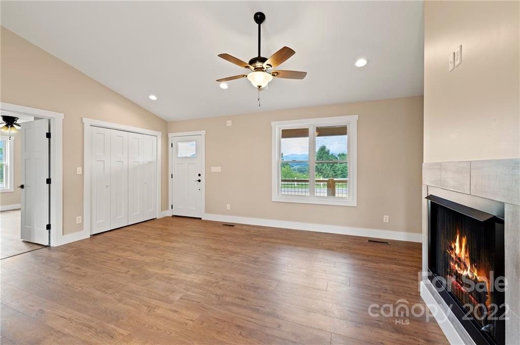 53 Sharptown Road Canton, NC 28716 - Photo 7 of 34 a view of an empty room with window and wooden floor