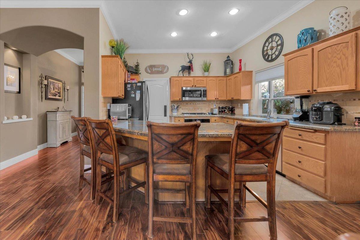 2474 Twain Avenue Clovis, CA 93611 - Photo 11 of 55 a view of a dining room with furniture and a kitchen