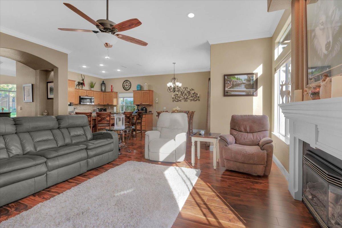 2474 Twain Avenue Clovis, CA 93611 - Photo 15 of 55 a living room with furniture and a chandelier