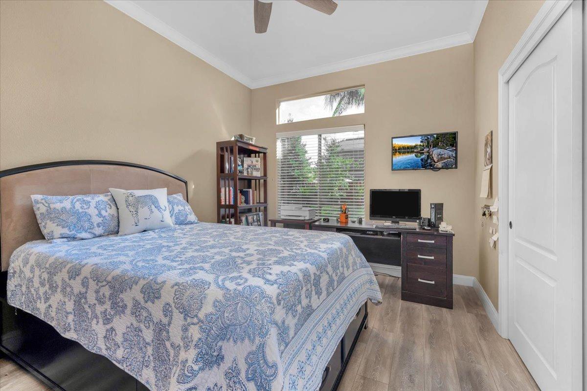 2474 Twain Avenue Clovis, CA 93611 - Photo 18 of 55 a bedroom with a bed and a flat screen tv