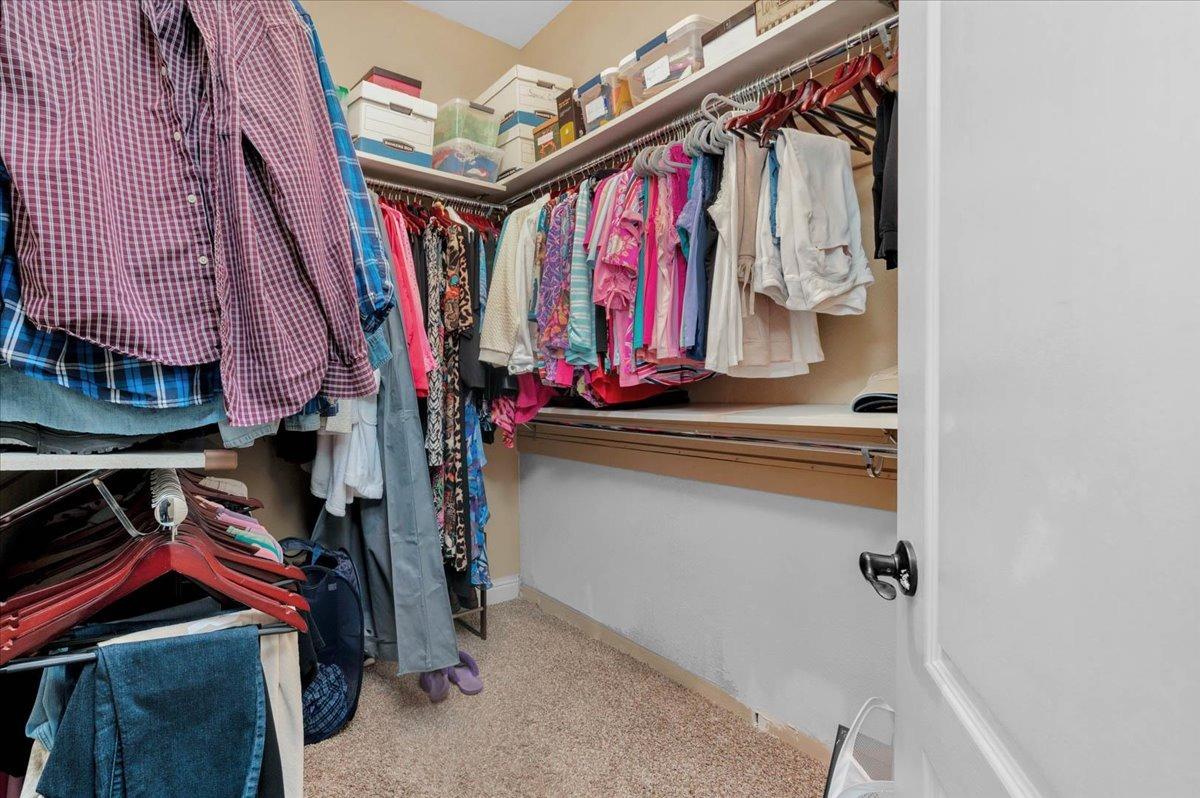 2474 Twain Avenue Clovis, CA 93611 - Photo 24 of 55 a view of walk in closet with clothes