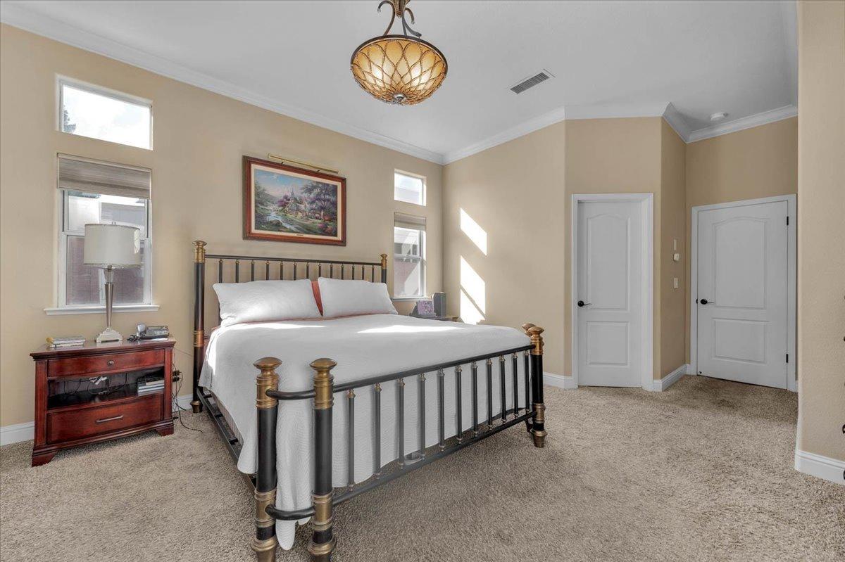 2474 Twain Avenue Clovis, CA 93611 - Photo 27 of 55 a bedroom with a bed and a table