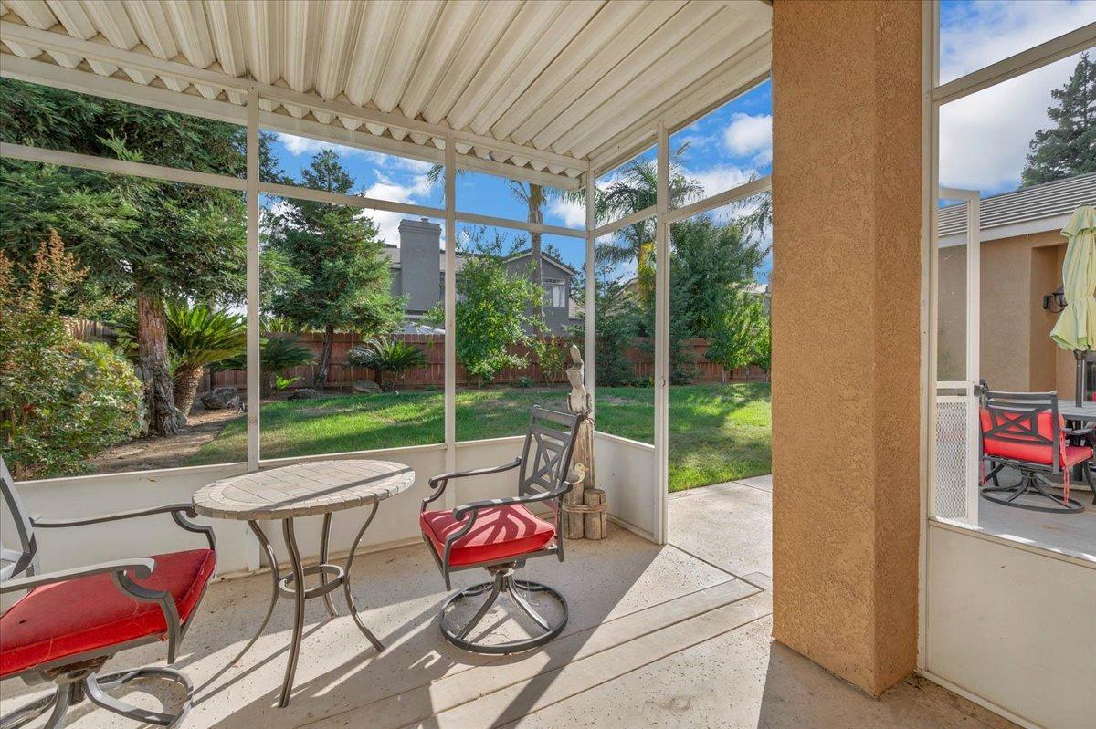 2474 Twain Avenue Clovis, CA 93611 - Photo 33 of 55 a view of a patio with a table chairs and a backyard