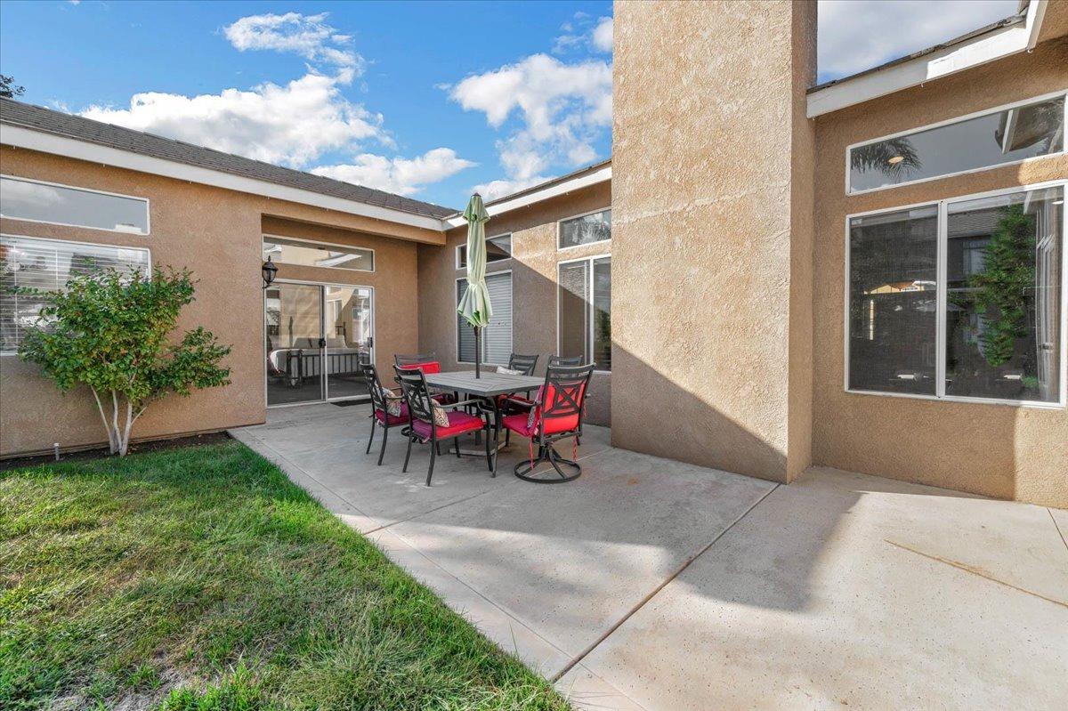 2474 Twain Avenue Clovis, CA 93611 - Photo 35 of 55 a view of a two chairs in the back yard of the house