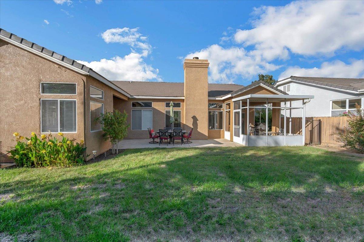 2474 Twain Avenue Clovis, CA 93611 - Photo 39 of 55 a view of a house with a backyard porch and sitting area