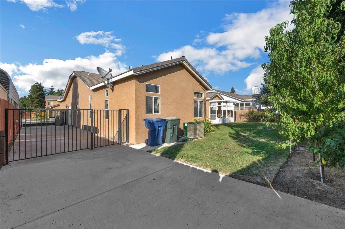 2474 Twain Avenue Clovis, CA 93611 - Photo 40 of 55 a view of a house with a small yard and plants