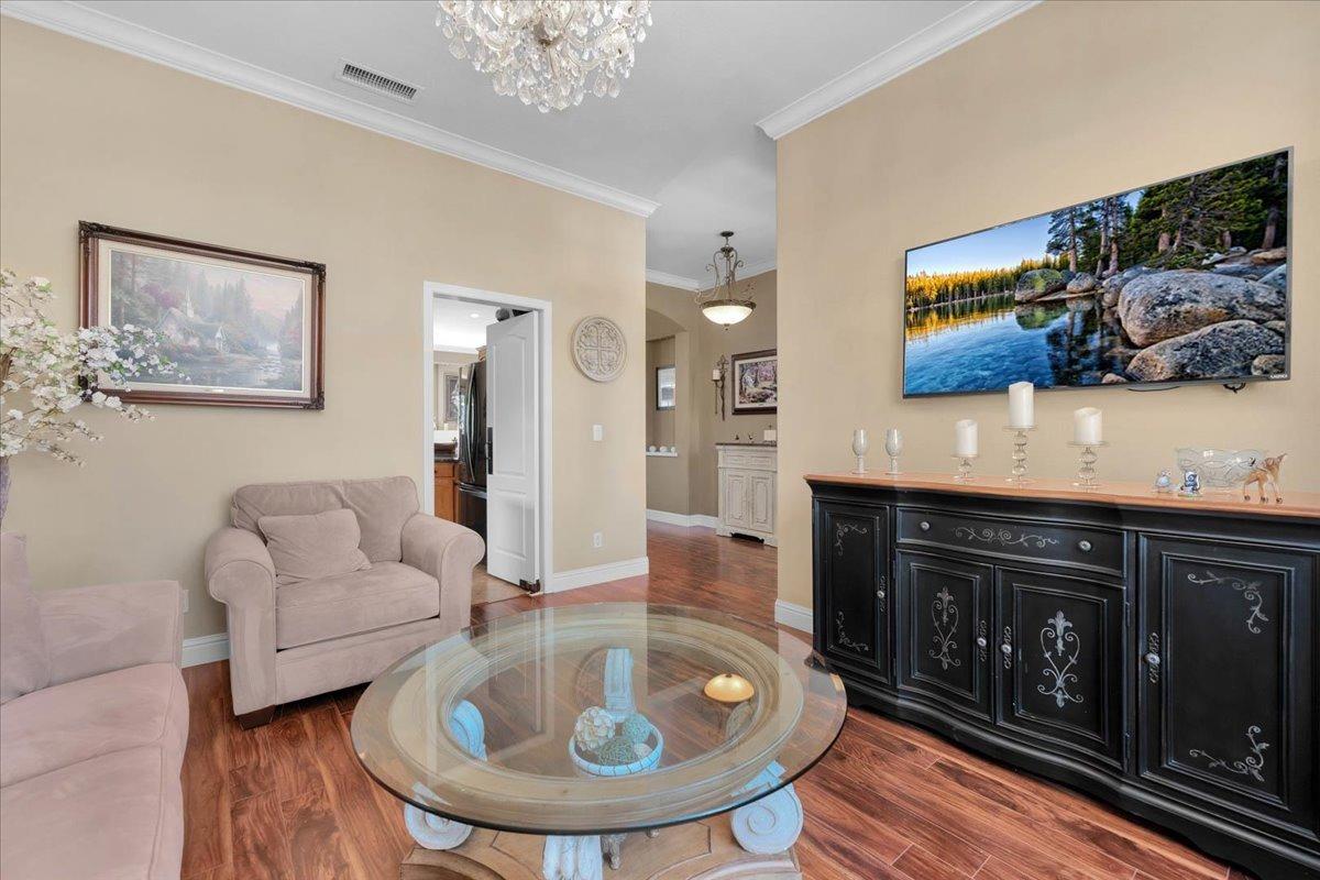 2474 Twain Avenue Clovis, CA 93611 - Photo 4 of 55 a living room with furniture and painting on the wall