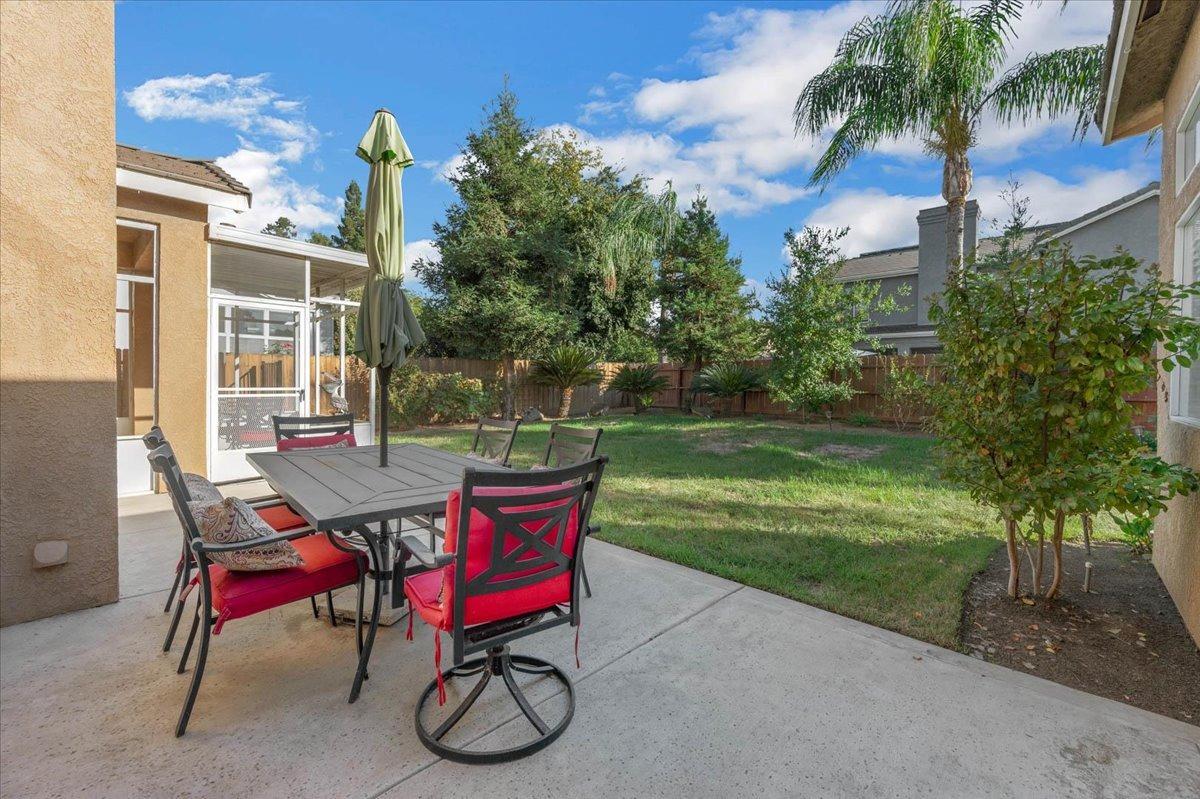 2474 Twain Avenue Clovis, CA 93611 - Photo 43 of 55 a view of a chairs and tables in the patio