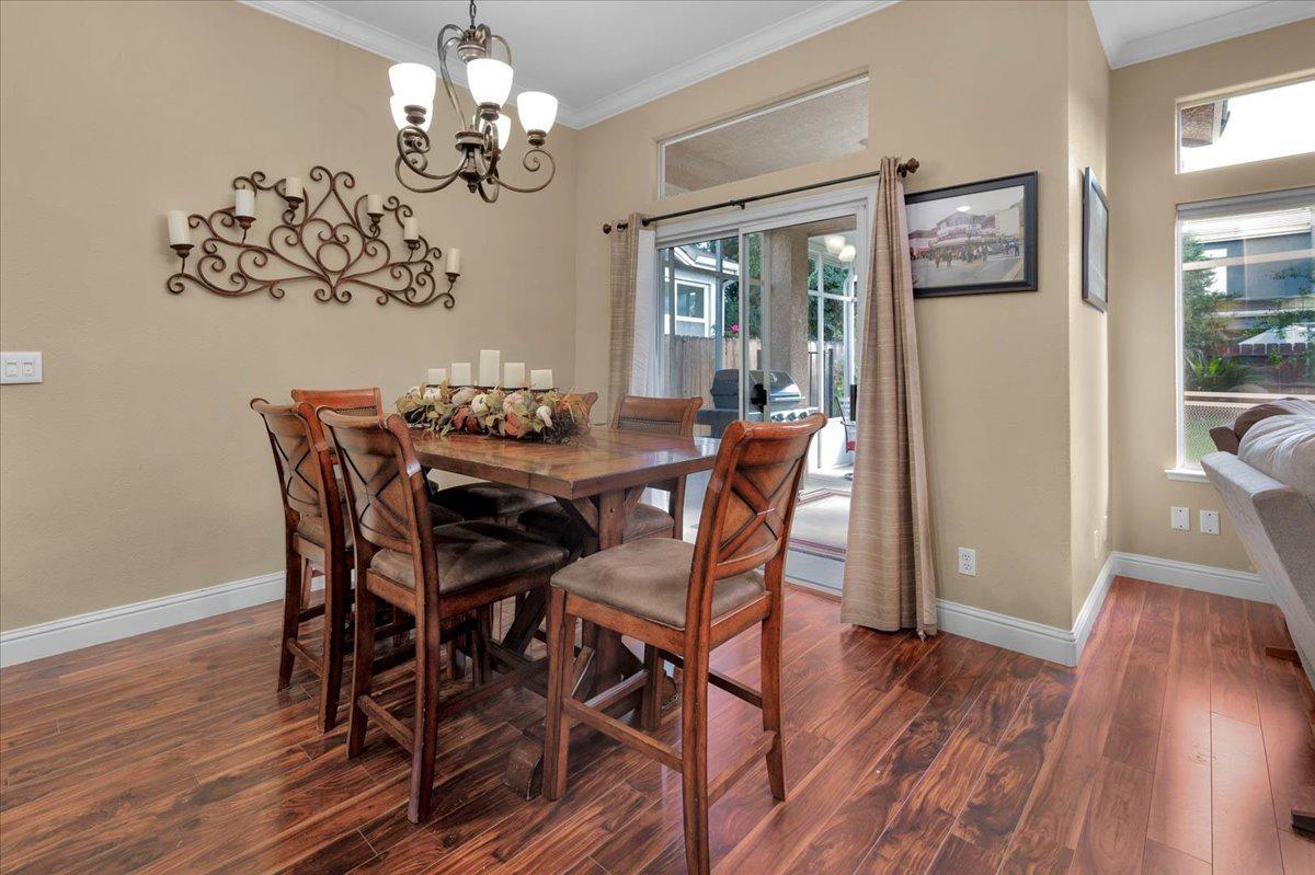 2474 Twain Avenue Clovis, CA 93611 - Photo 10 of 55 a view of a dining room with furniture wooden floor and chandelier