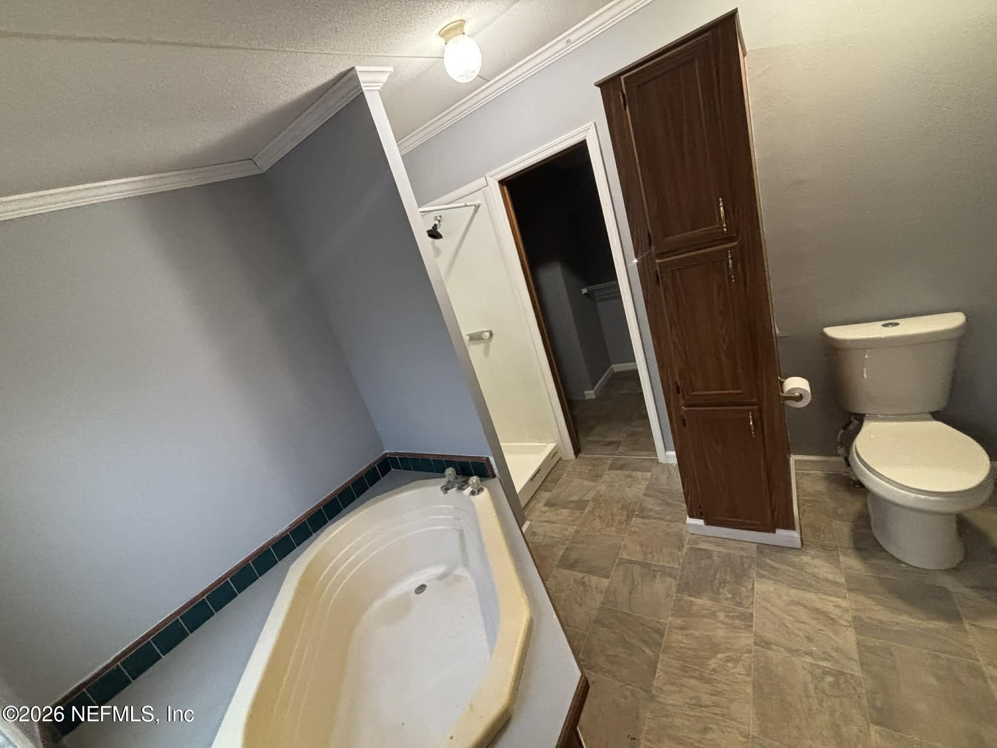 7624 Southwest County Road 225 Starke, FL 32091 - Photo 25 of 56 a bathroom with a toilet and a shower