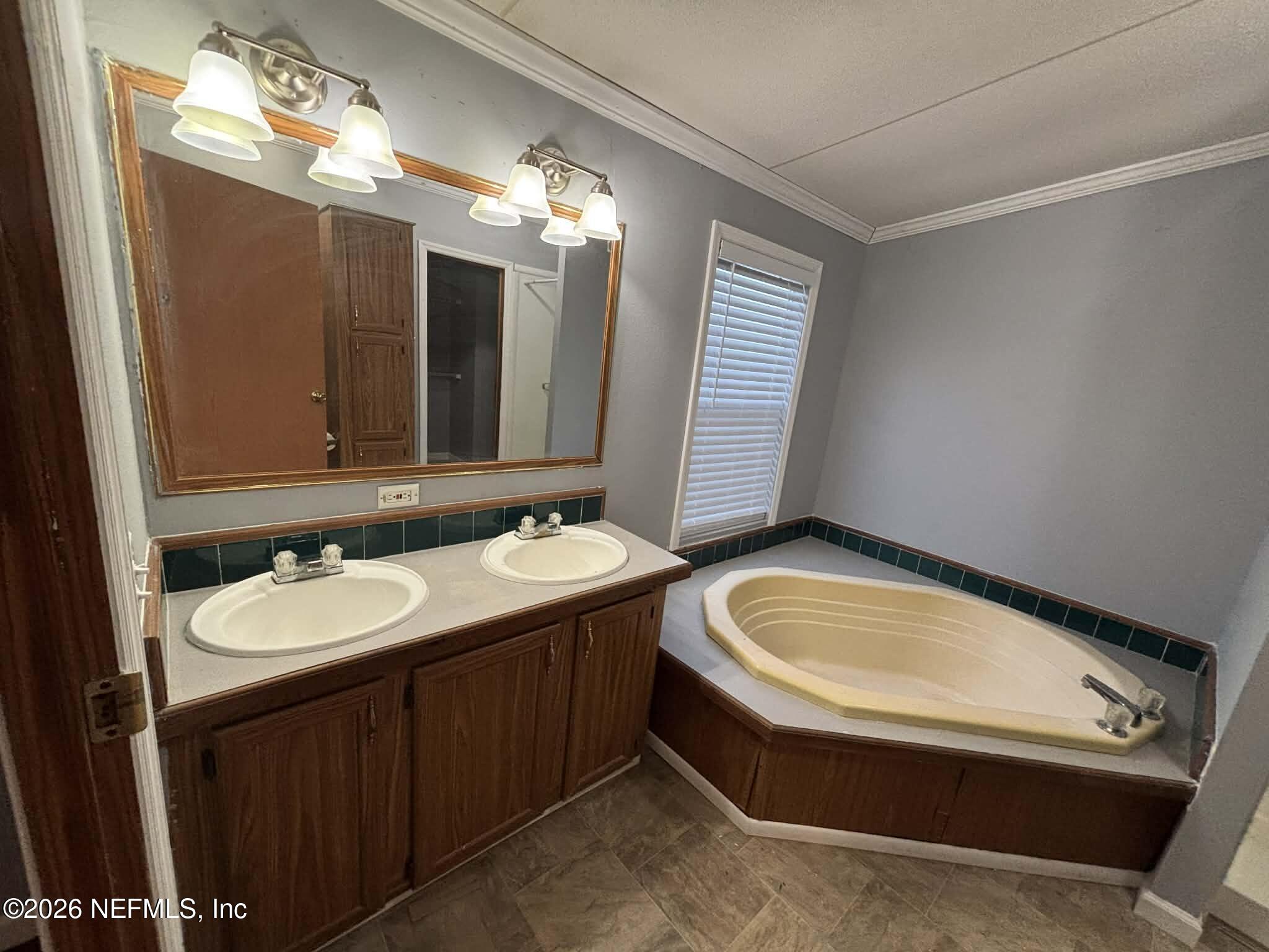 7624 Southwest County Road 225 Starke, FL 32091 - Photo 26 of 56 a bathroom with a sink and a mirror