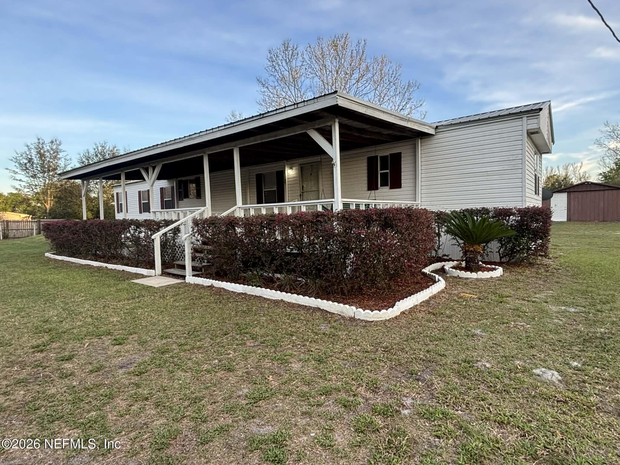 7624 Southwest County Road 225 Starke, FL 32091 - Photo 3 of 56 a front view of house with yard and green space