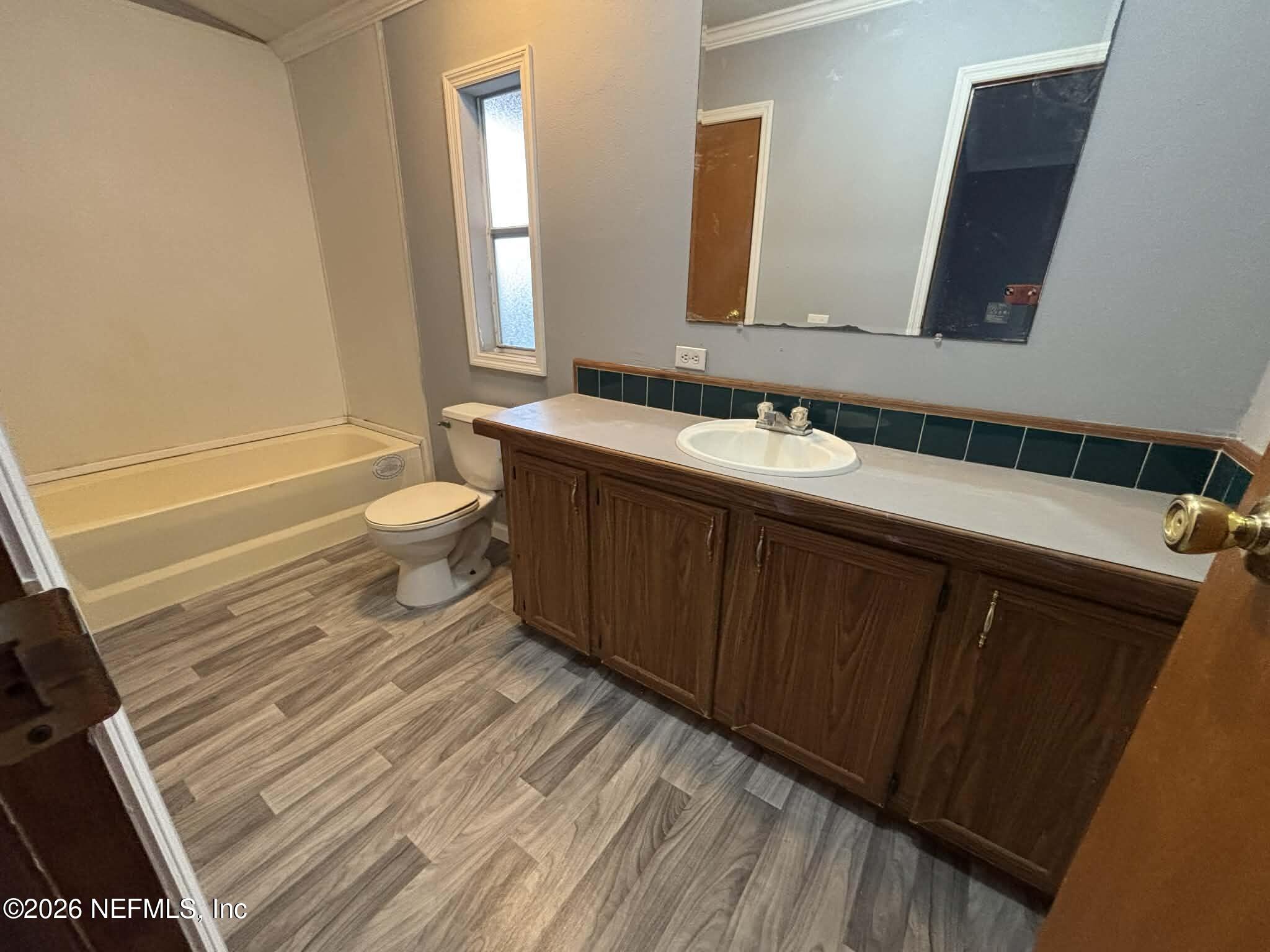 7624 Southwest County Road 225 Starke, FL 32091 - Photo 34 of 56 a bathroom with a sink and a mirror