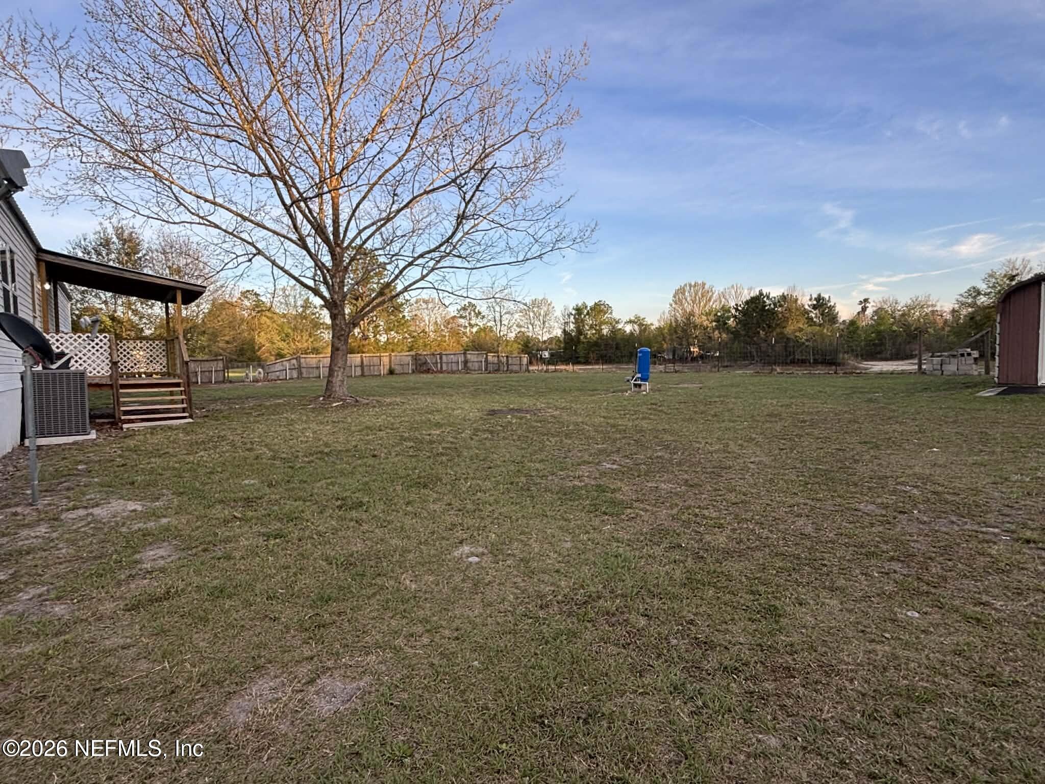 7624 Southwest County Road 225 Starke, FL 32091 - Photo 41 of 56 a view of outdoor space with deck and trees