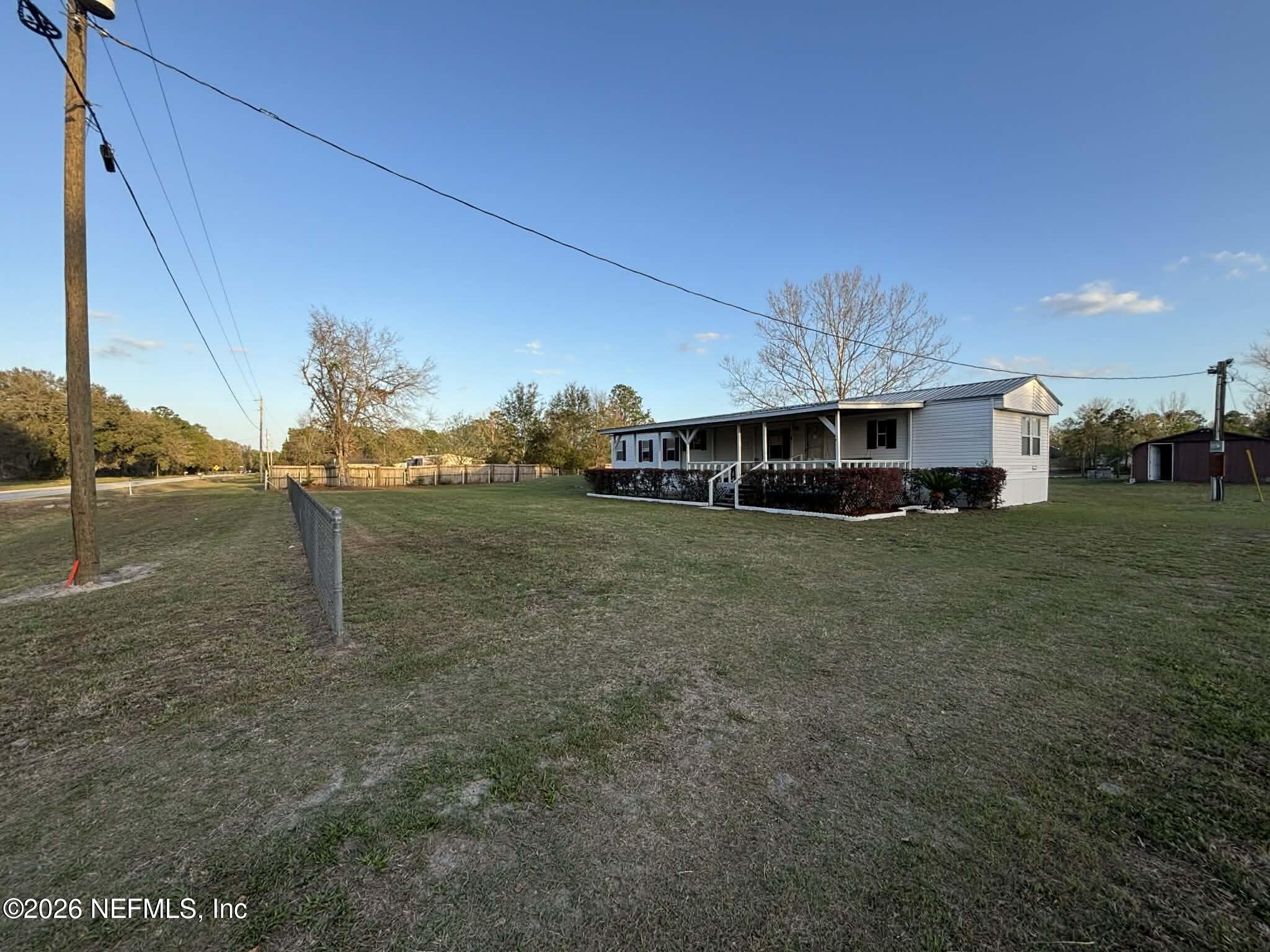 7624 Southwest County Road 225 Starke, FL 32091 - Photo 48 of 56 a front view of a house with a yard