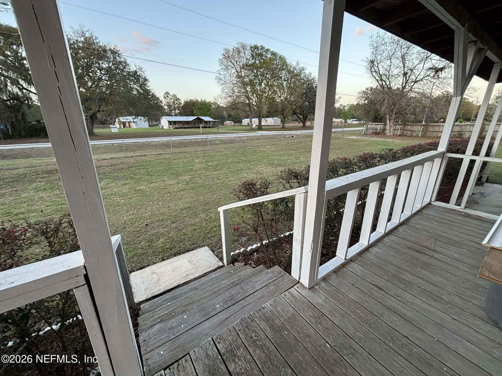 7624 Southwest County Road 225 Starke, FL 32091 - Photo 53 of 56 a view of a balcony with wooden floor and fence