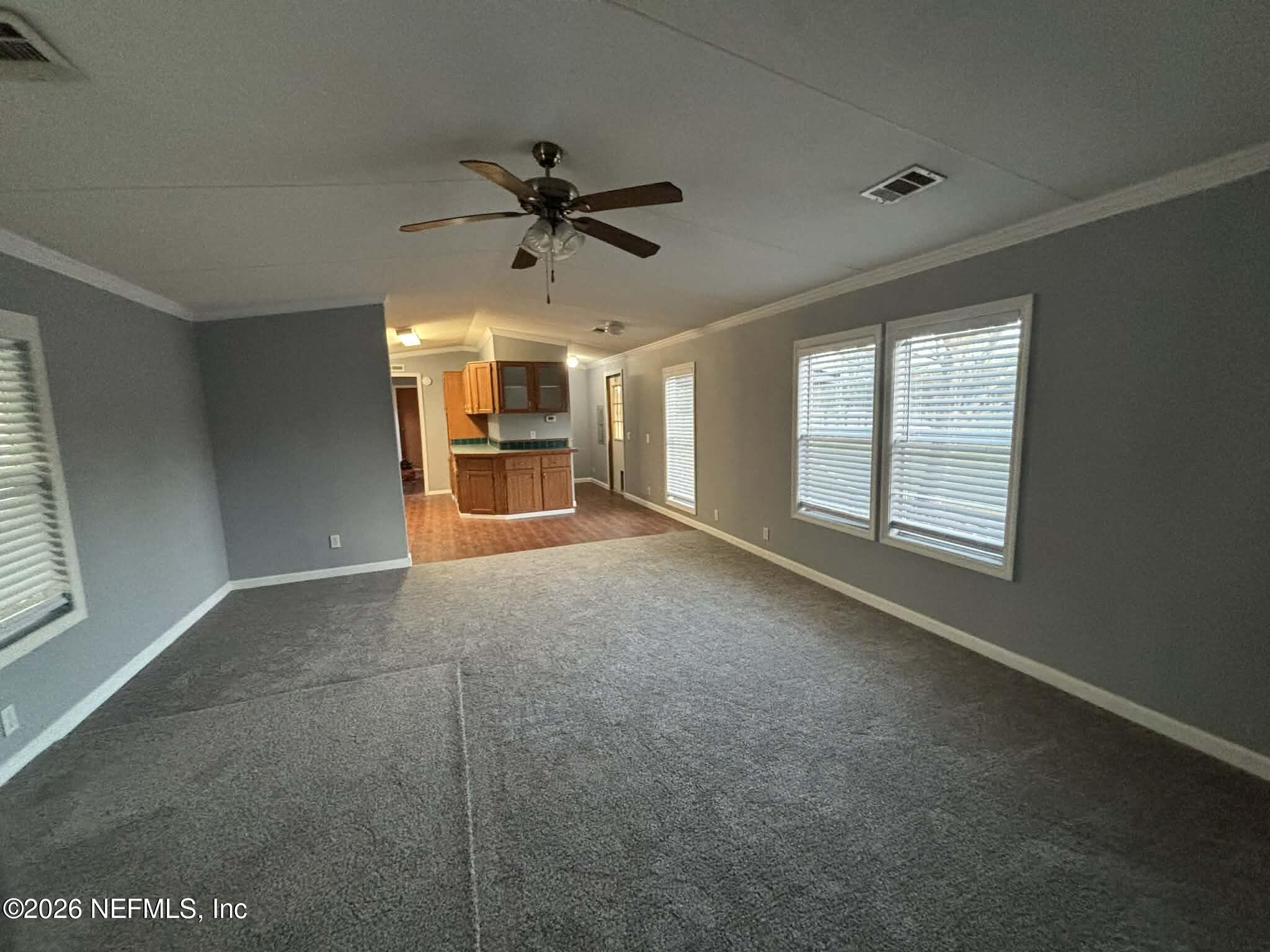 7624 Southwest County Road 225 Starke, FL 32091 - Photo 10 of 56 a view of a livingroom with a ceiling fan and window