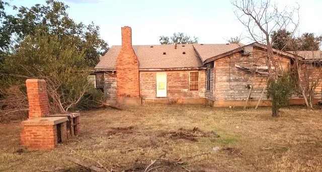 an outdoor space with patio table and chairs