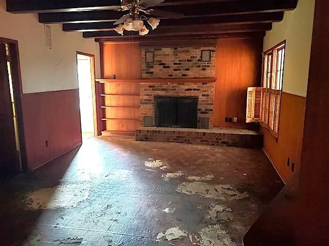a view of a fireplace in an empty room