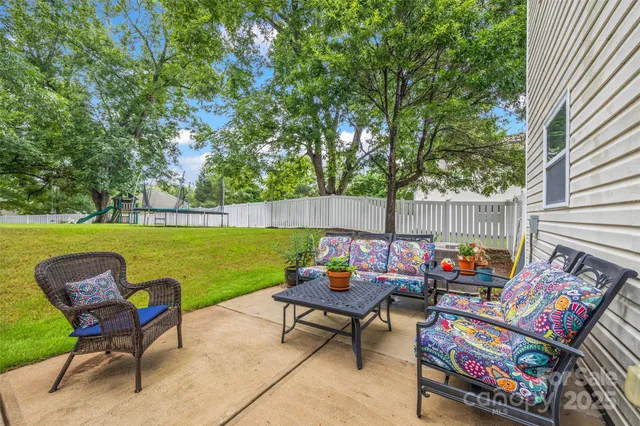 a backyard of a house with outdoor seating