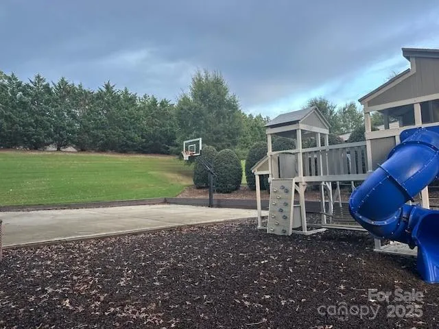 a view of a porch with furniture and a yard
