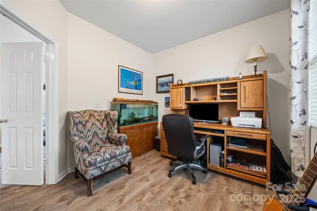 a workspace with furniture and a window