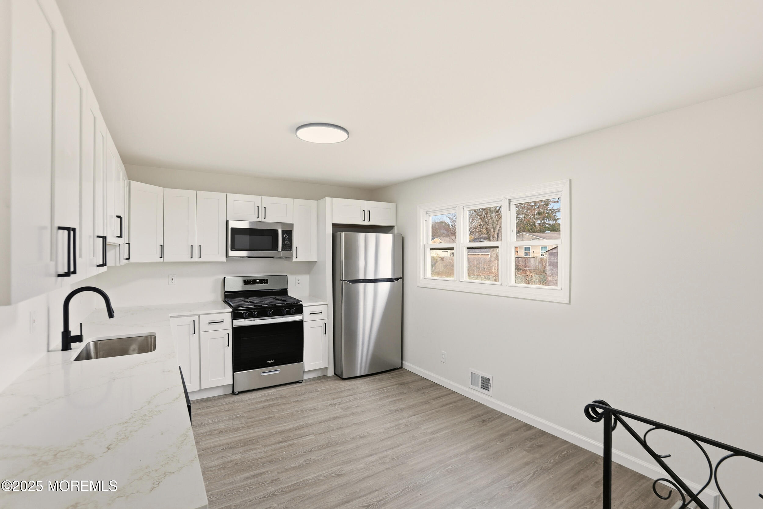 28 Brandies Road Toms River, NJ 08757 - Photo 11 of 30 a kitchen with stainless steel appliances granite countertop a stove a sink and a refrigerator