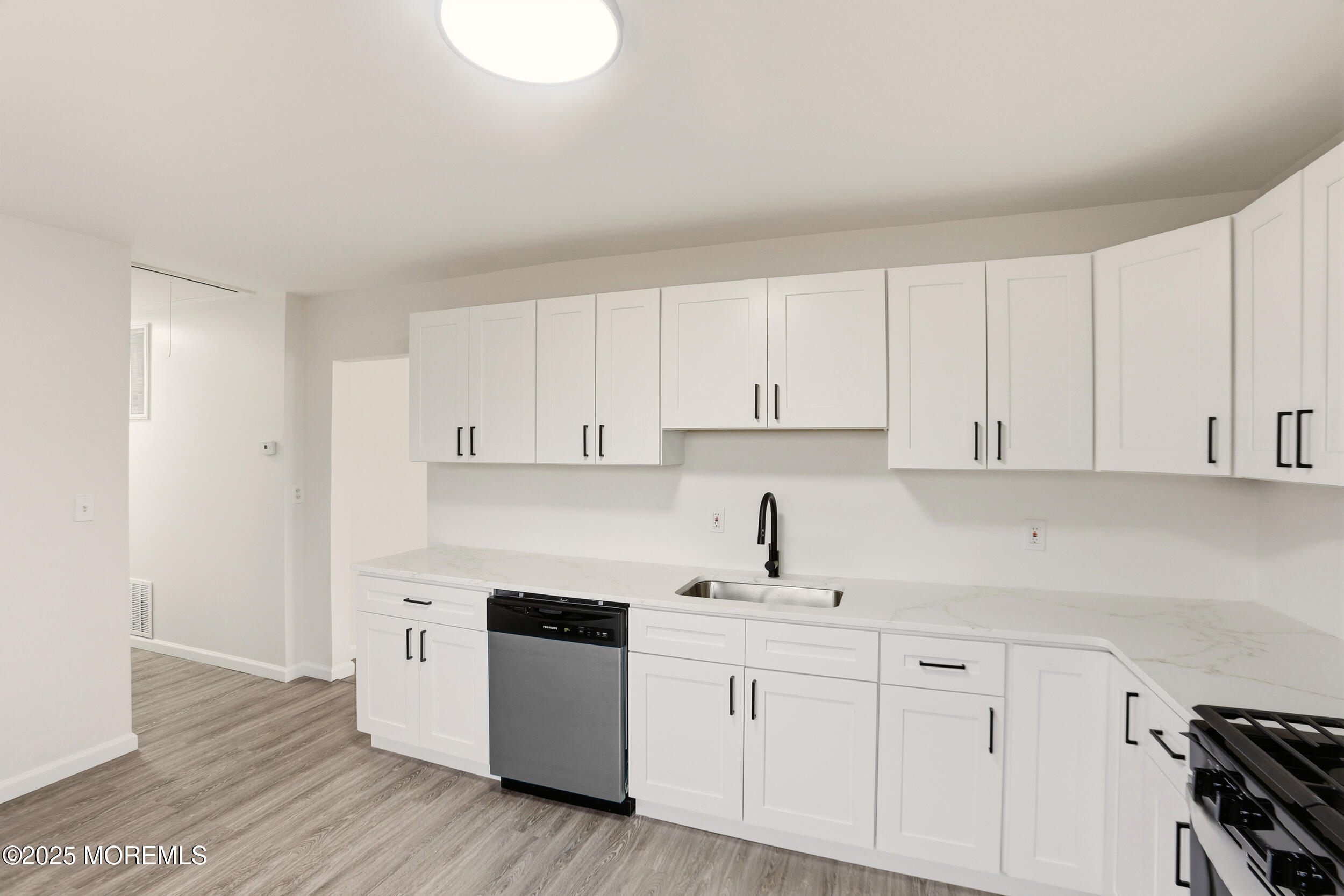 28 Brandies Road Toms River, NJ 08757 - Photo 14 of 30 a kitchen with cabinets and white appliances