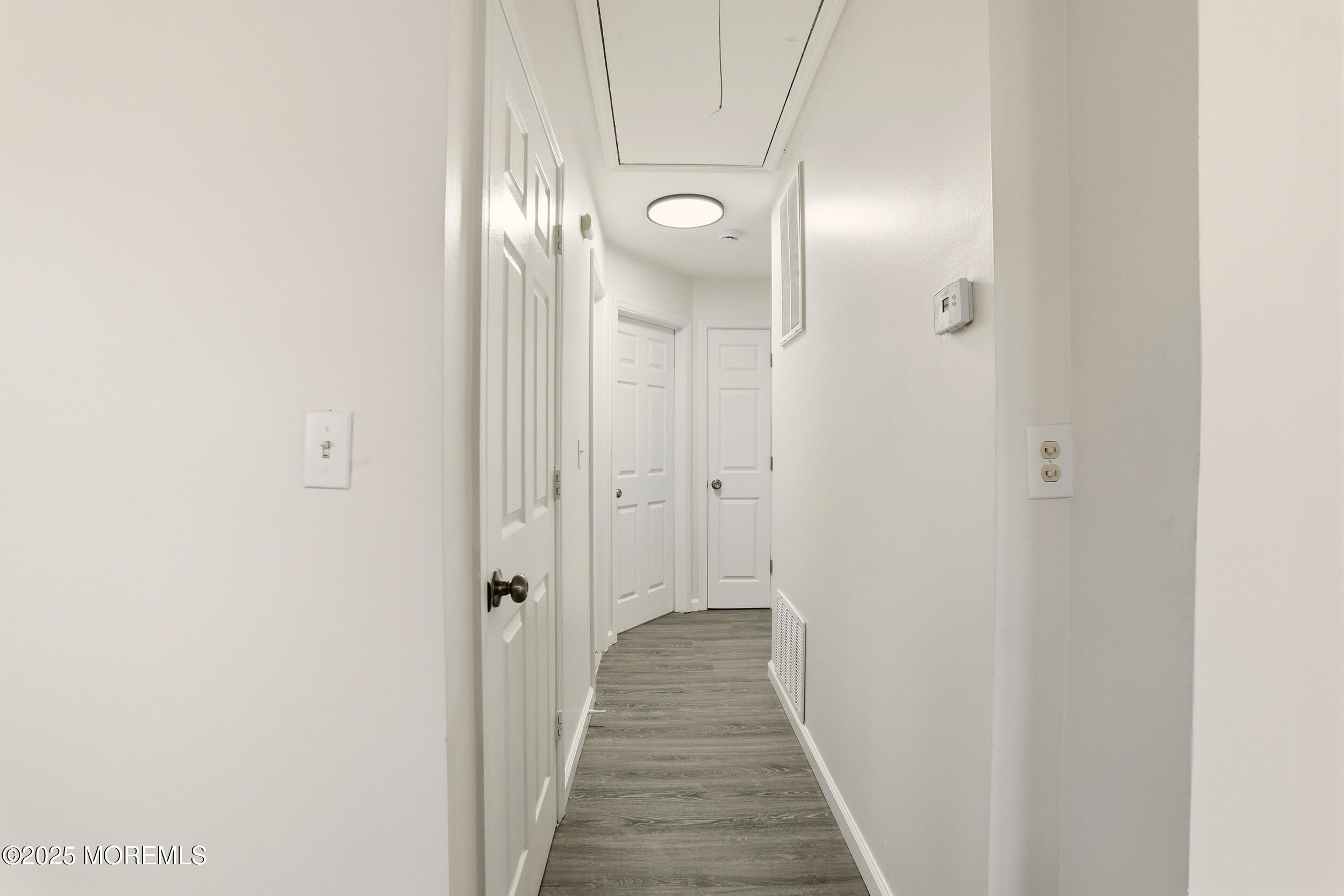 28 Brandies Road Toms River, NJ 08757 - Photo 15 of 30 a view of a hallway with wooden floor