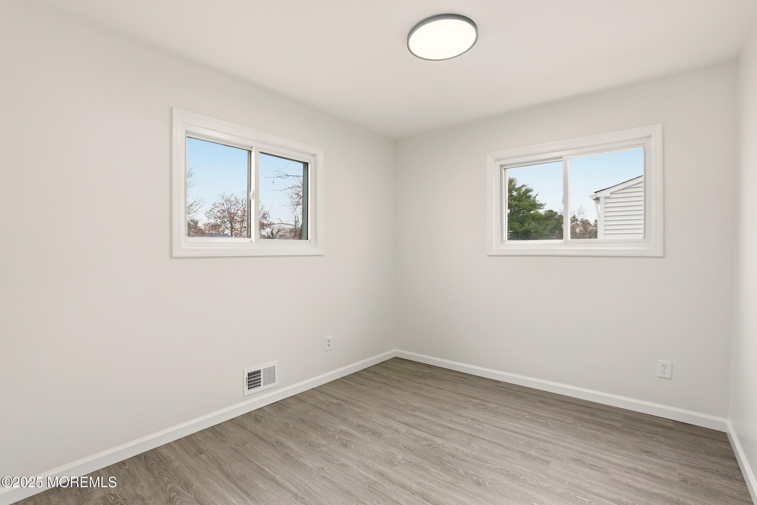 28 Brandies Road Toms River, NJ 08757 - Photo 16 of 30 an empty room with a window