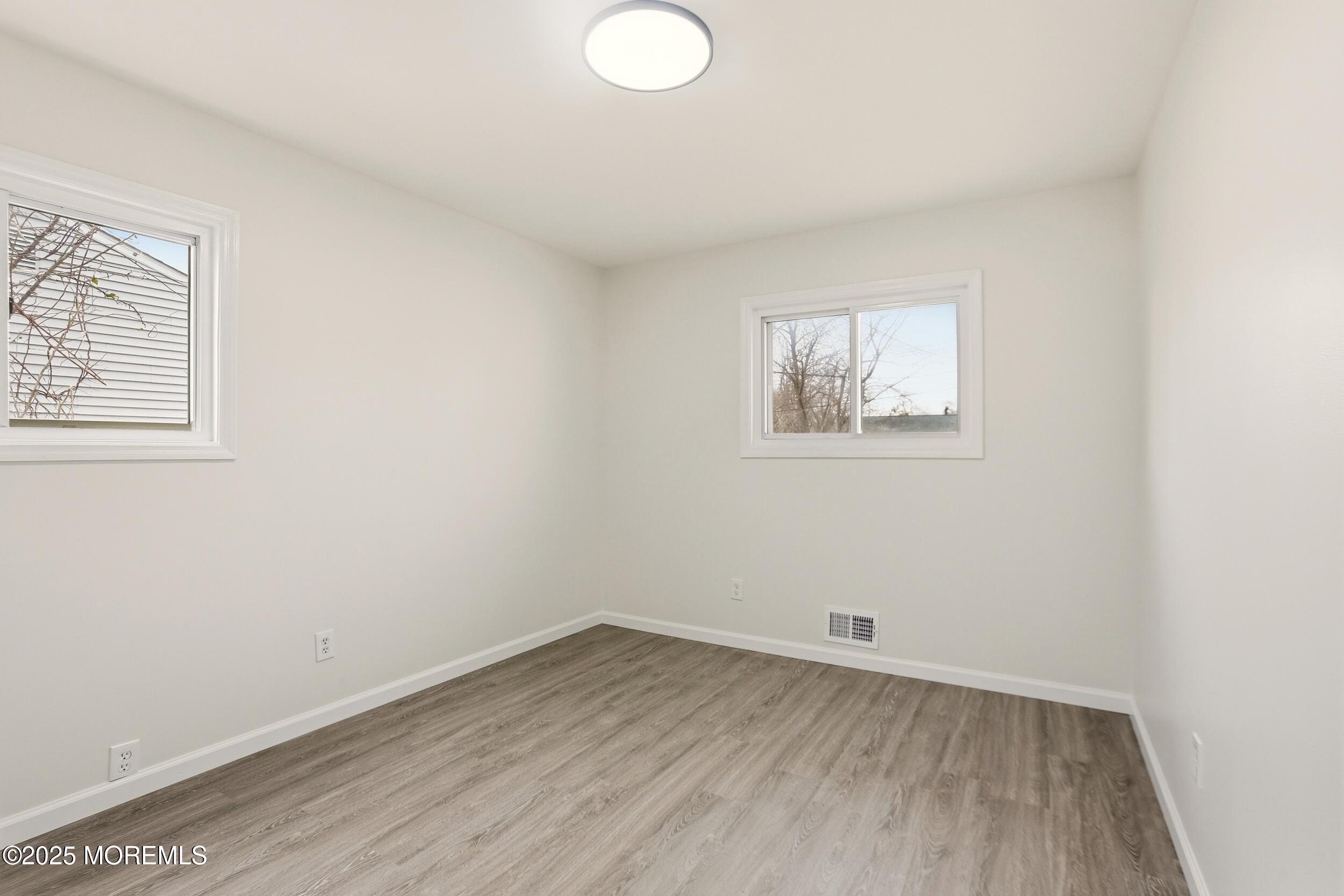 28 Brandies Road Toms River, NJ 08757 - Photo 17 of 30 an empty room with a window