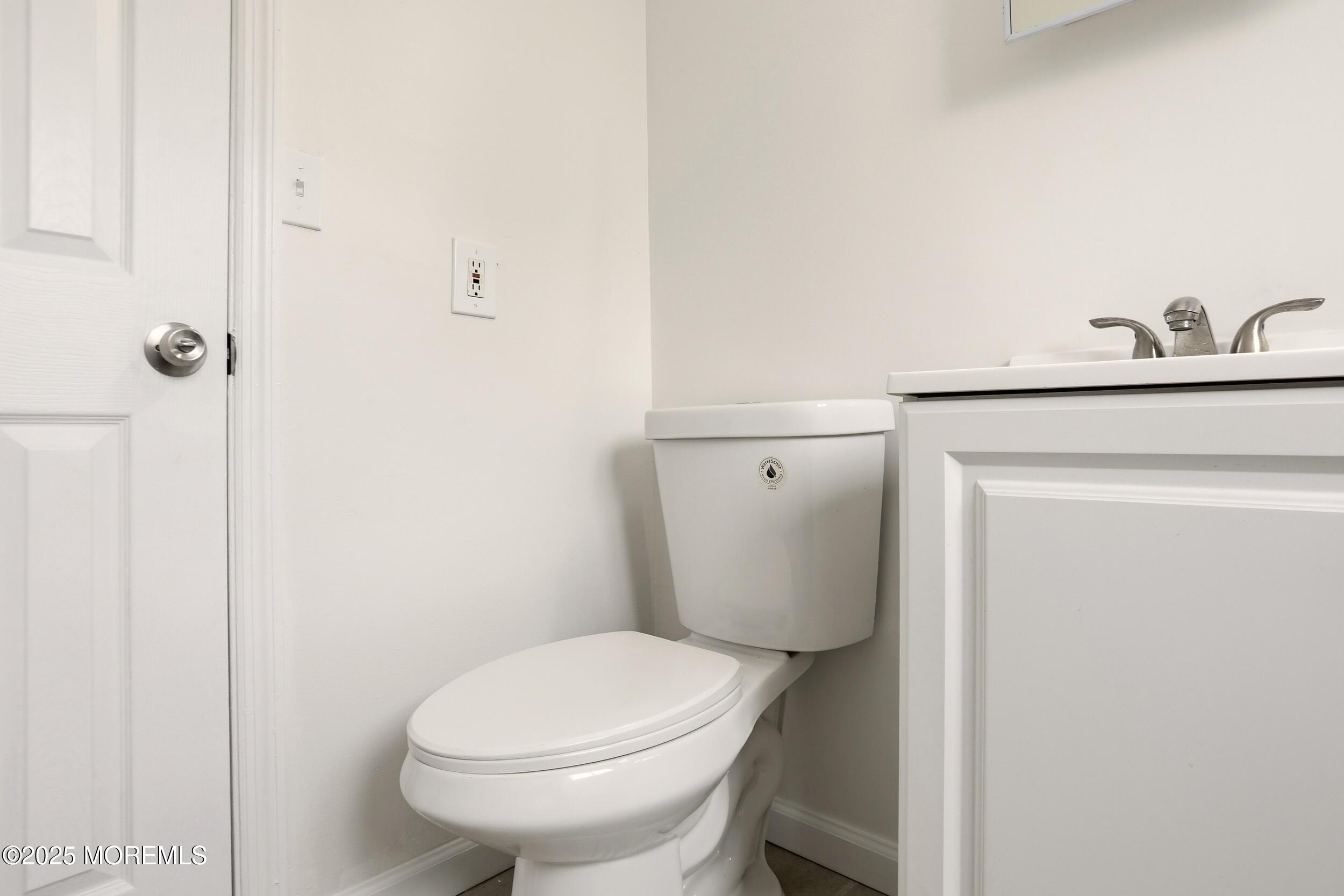 28 Brandies Road Toms River, NJ 08757 - Photo 22 of 30 a white toilet sitting next to a bathroom sink