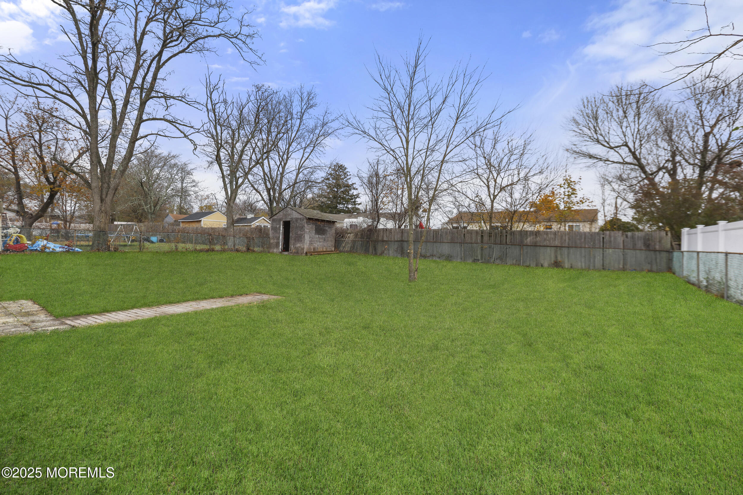 28 Brandies Road Toms River, NJ 08757 - Photo 30 of 30 a view of a backyard with large trees