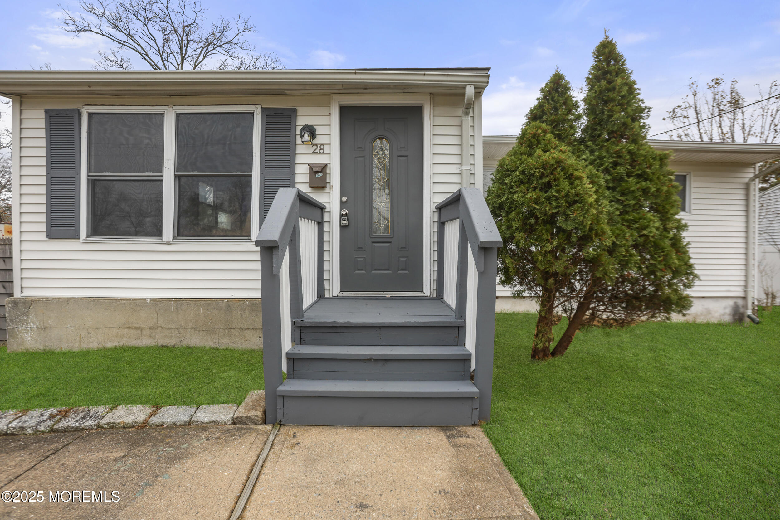 28 Brandies Road Toms River, NJ 08757 - Photo 4 of 30 a front view of a house with a garden