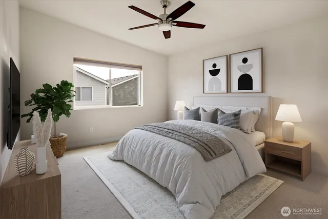 a bedroom with a large bed and a window