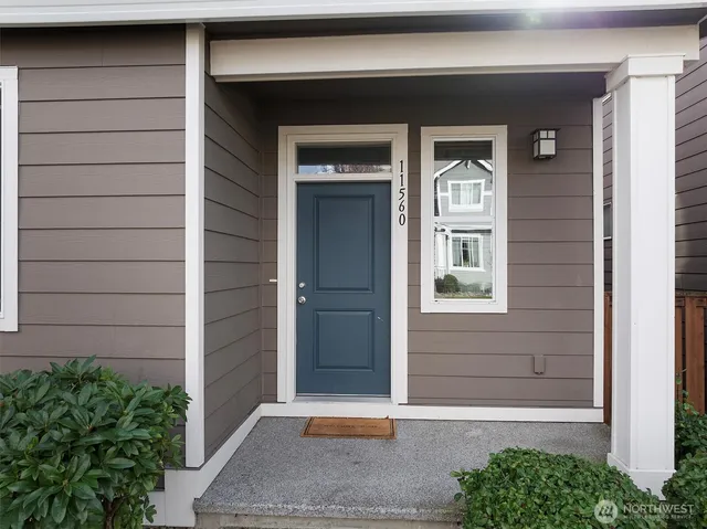 a front view of a house with a garage