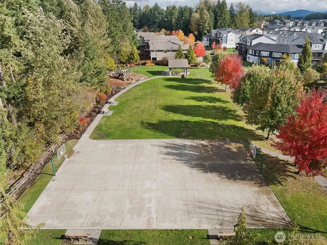 a view of a park with houses