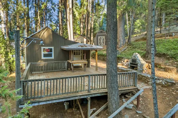 a view of a house with a porch and furniture
