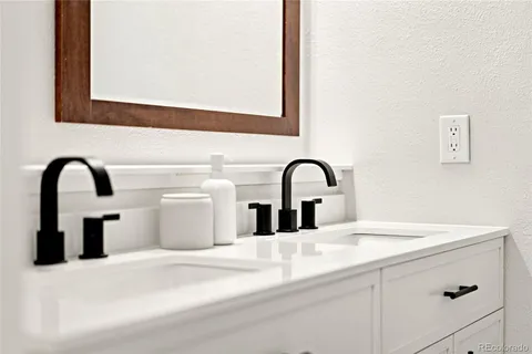a view of a sink and mirror