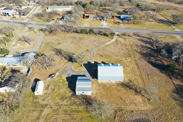 a view of yard with large trees